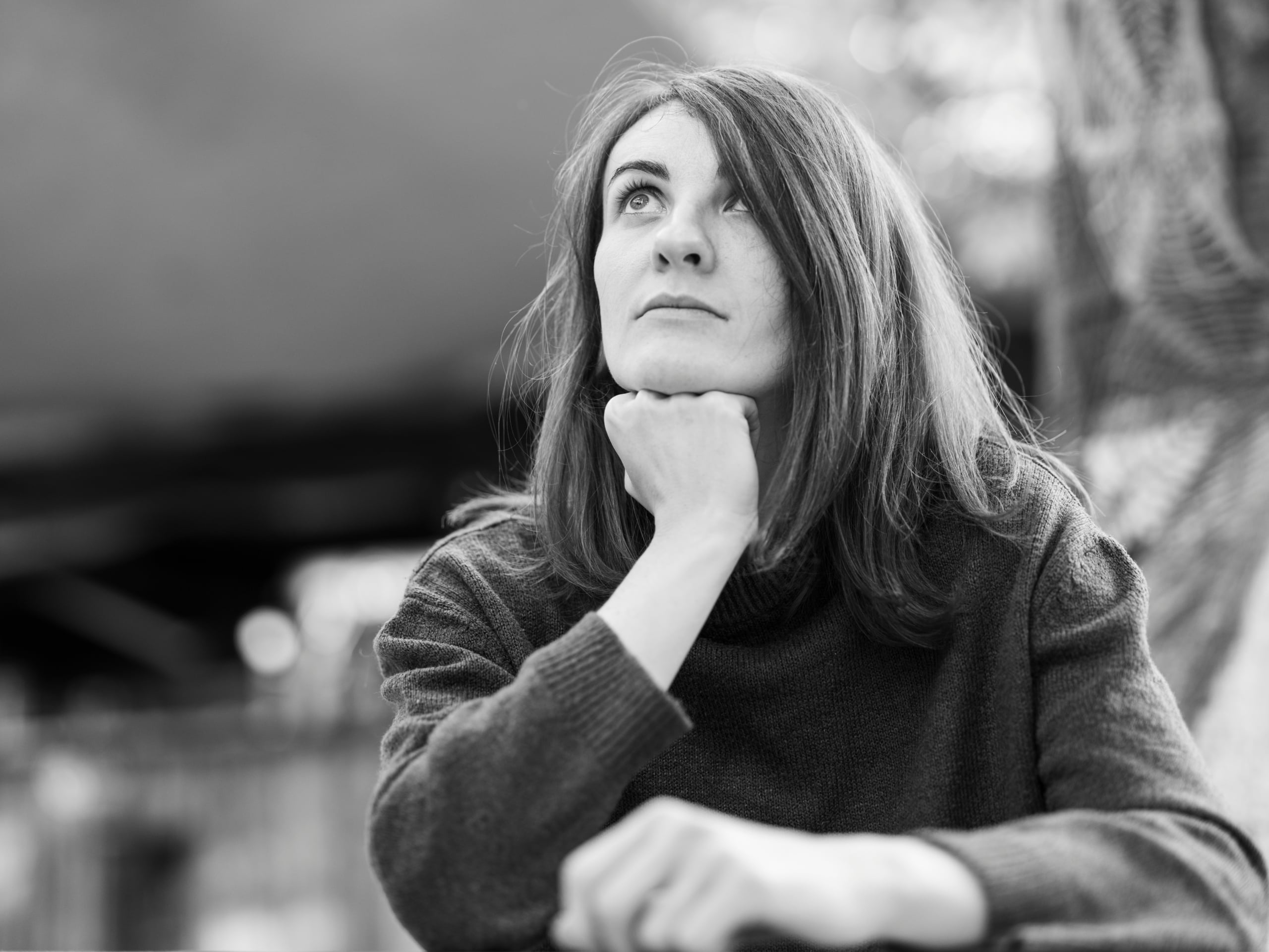 black and white image, woman thinking